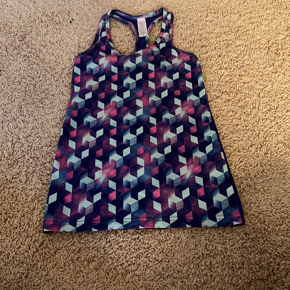 ivivva tank, patterned front, good for workouts or casual wear.